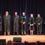 Seven faculty members await their turn to be recognized during ceremony